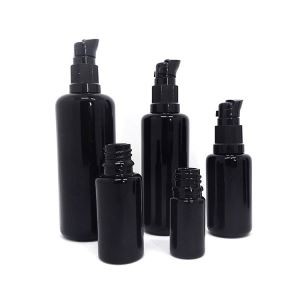 Balang kaca gelap dengan lid untuk kosmetik